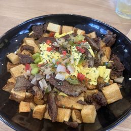 Breakfast bowl - with the crispiest sausage and potatoes, and some fluffy eggs. Breakfast bowl - with the crispiest sausage and potatoes, and some fluffy eggs.