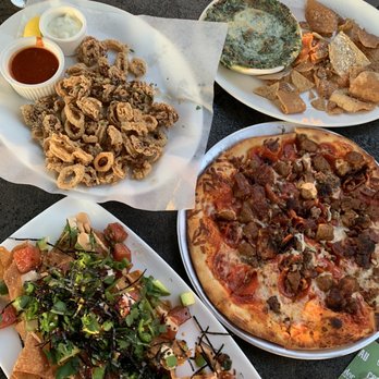 Yard House - Poke nachos, calamari, spinach and cheese dip, meat lovers pizza. - Bars Near Me - Long Beach, California