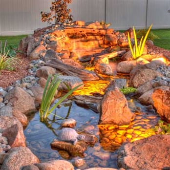 Nature's Touch Ponds - a water feature in a backyard - Lighting Fixtures & Equipment Near Me Nature's Touch Ponds - a water feature in a backyard - Lighting Fixtures & Equipment Near Me