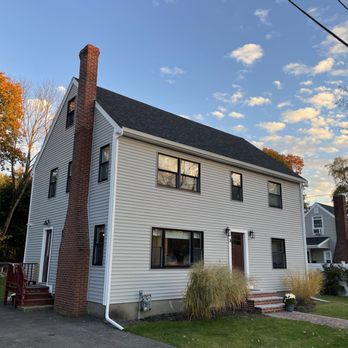 Ngt Construction - a white house with a brick chimney - General Contractors Near Me Ngt Construction - a white house with a brick chimney - General Contractors Near Me