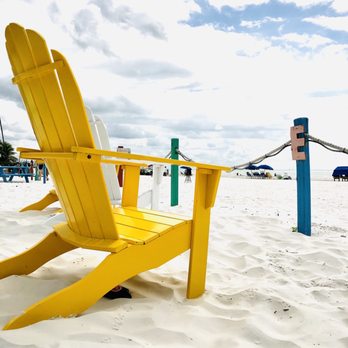 Junkanoo Below Deck - a yellow chair on the beach - American Near Me - Fort Myers Beach, Florida Junkanoo Below Deck - a yellow chair on the beach - American Near Me - Fort Myers Beach, Florida