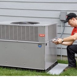 Southern Seasons Heating & Air Conditioning - John working on a Bryant heat pump package unit in Mount Pleasant, SC
