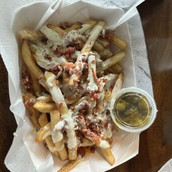 Hammered Cow - Loaded Bacon queso fries with jalapeños on the side - Burgers Near Me - Mobile, Alabama Hammered Cow - Loaded Bacon queso fries with jalapeños on the side - Burgers Near Me - Mobile, Alabama