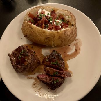 The Suburban - Steak night deal: two 4 oz. filets medium rare with baked potato - American Near Me - Leavenworth, Kansas