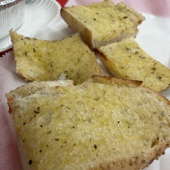 Beni's Pizza - Toasted buttery garlic sesame bread comes with any salad purchase - Pizza Near Me - Lake Dallas, Texas