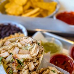 Carbon - Tequila Lime Marinated Fire Grilled Chicken Breast Taco Black Beans, rice, chips and hot salsa.