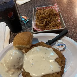 Chicken Fried Steak with mashed potatoes and onion rings Chicken Fried Steak with mashed potatoes and onion rings
