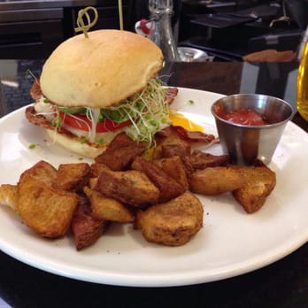 Sleepy Bee Cafe - Oakley - Broakley: local brioche bun, bacon, sprouts, broken yolk egg, avocado, white cheddar, tomato, with hive fries - Breakfast & Brunch Near Me - Cincinnati, Ohio