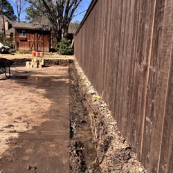 Exo Excavation - Trenching was performed for the installation of a retaining wall