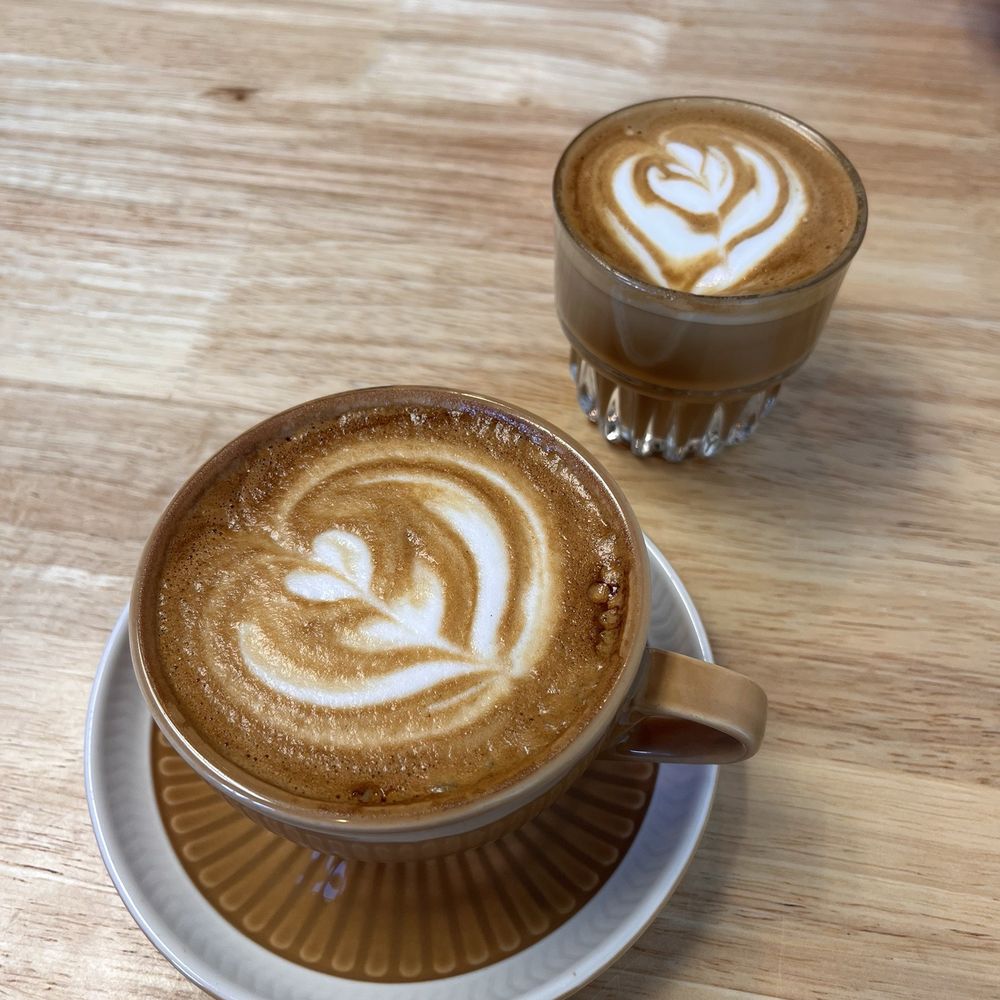 Large cup is a flat white Small cup is a cortado also amazing Large cup is a flat white Small cup is a cortado also amazing