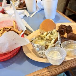 The Lighthouse Grill - Baked potato, steak bites, butter, sour cream and fries.