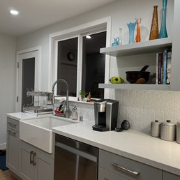a kitchen with a sink and a dishwasher a kitchen with a sink and a dishwasher