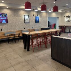 Wendy's - Dining area 2 booths 3 2-seater table on long share table And many counter spots along the wall