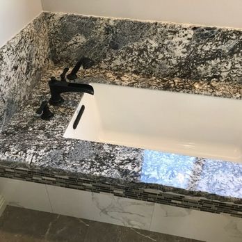 EcoStar Remodeling & Construction - Bathtub with chisled edge granite surround, master bathroom - General Contractors Near Me - Encino, California