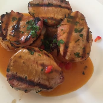 Meson Sabika - I believe this is the Montaditos de Cerdo (someone correct me if I'm wrong) laid on a bed of Carmelized onions on toast. A savory tapas - Tapas Bars Near Me - Naperville, Illinois