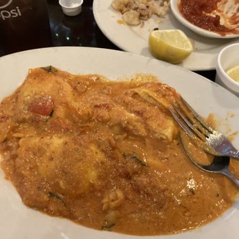 Luigi's Italian Restaurant - a plate of omelette with a fork and a glass of beer - Italian Near Me - Belton, Texas