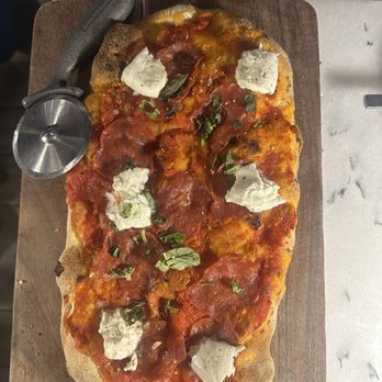Pinsa Rossa - SPICY CALABRIAN San Marzano tomato, buffalo mozzarella, oregano, fresh basil, spicy salami, Calabrian paste, evoo $22; 5/10 flavor profile - Italian Near Me - San Francisco, California