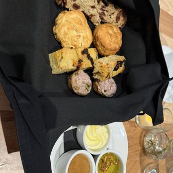 Cafe Momentum Dallas - House-made bread basket with butter, dipping oil, and jam - New American Near Me - Dallas, Texas