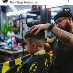 The Village Barbershop - Cave man the barber with a mid fade design
