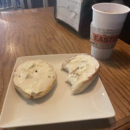 Bagel with cream cheese and a medium coffee Bagel with cream cheese and a medium coffee