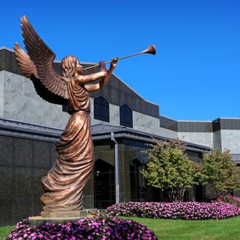 Guardian Angel Cemetery - Our Trumpeting Angel in front of the Angel of Peace Mausoleum. - Funeral Services & Cemeteries Near Me - Oakland, Michigan Guardian Angel Cemetery - Our Trumpeting Angel in front of the Angel of Peace Mausoleum. - Funeral Services & Cemeteries Near Me - Oakland, Michigan
