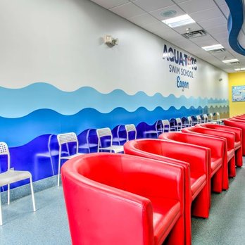 Aqua-Tots Swim School Eagan - Big red chairs in pool room lobby - Swimming Lessons/Schools Near Me - Eagan, Minnesota