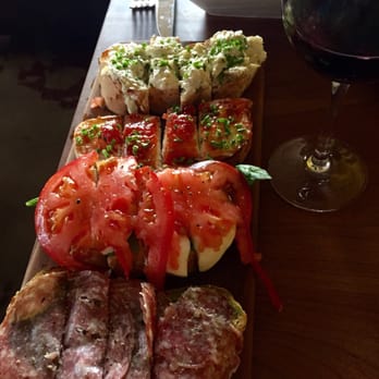 Postino Arcadia - salami with pesto, fresh mozzarella with tomato and basil, tomato jam & fresh sheeps milk cheese, and warm artichoke spread. - Wine Bars Near Me - Phoenix, Arizona