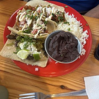 Amigos - Carne Asada taco on a corn tortilla  Baja Fries Fish tacos on corn tortillas  Refried beans  Rice - Mexican Near Me - Key West, Florida