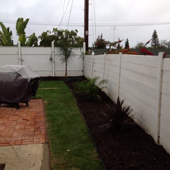New Vision Landscape - Bark flower beds with palm trees. I asked for low maintenance landscaping and that's what I got! - Landscaping Near Me New Vision Landscape - Bark flower beds with palm trees. I asked for low maintenance landscaping and that's what I got! - Landscaping Near Me