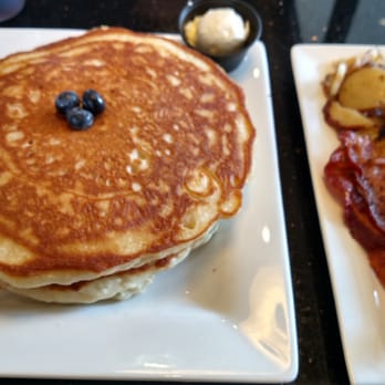 Keke's Breakfast Cafe - blueberry pancakes with the fixings on the side. (blueberries cooked inside, so many blueberries!) - American Near Me - Ocoee, Florida Keke's Breakfast Cafe - blueberry pancakes with the fixings on the side. (blueberries cooked inside, so many blueberries!) - American Near Me - Ocoee, Florida