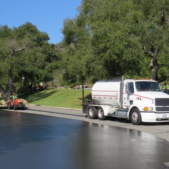 AMS Paving - a truck driving down a street - Masonry/Concrete Near Me - San Diego, California