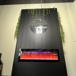 a fireplace with a clock above it a fireplace with a clock above it
