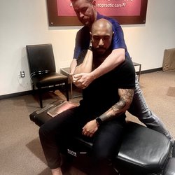 The Joint Chiropractic - Dr. Rehmann adjusting right shoulder.
