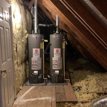 Telles Remodeling - Entry Door to unfinished room.  Hot water heaters located in room as well. - General Contractors Near Me