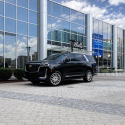 Black Cadillac Escalade at Halls Chophouse for private executive dinner transportation in Nashville.