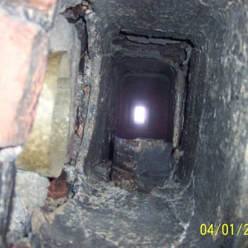 Complete Chimney Service - This is a deteriorated clay tile liner servicing and oil furnace. This liner is cracked, separated, and not air tight. - Chimney Sweeps Near Me - Stoughton, Massachusetts Complete Chimney Service - This is a deteriorated clay tile liner servicing and oil furnace. This liner is cracked, separated, and not air tight. - Chimney Sweeps Near Me - Stoughton, Massachusetts