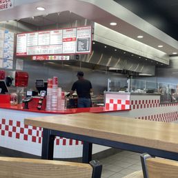 a restaurant with a counter and a counter top