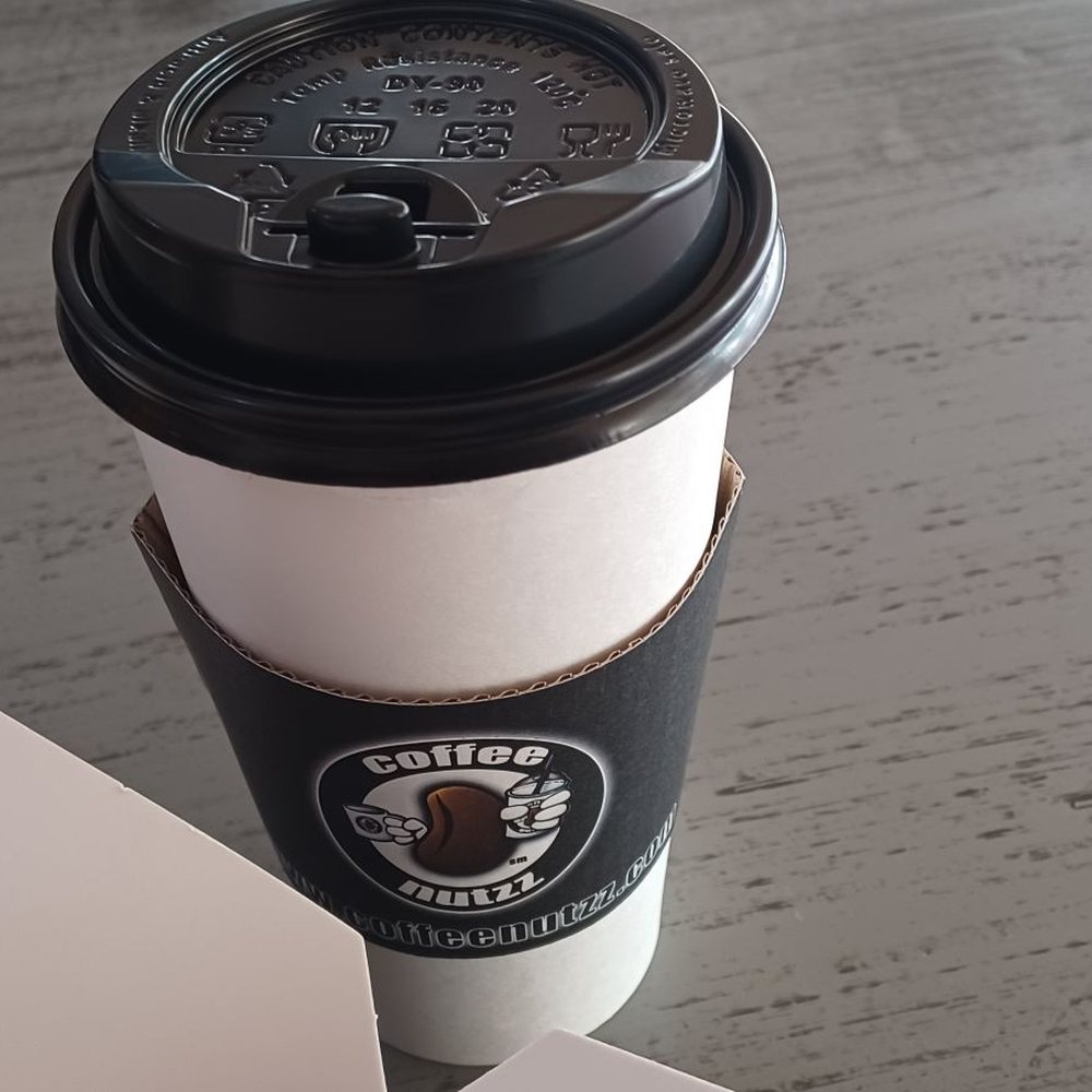 Coffee Nutzz - a cup of coffee and a box of donuts - Coffee & Tea Near Me - Rancho Cucamonga, California Coffee Nutzz - a cup of coffee and a box of donuts - Coffee & Tea Near Me - Rancho Cucamonga, California