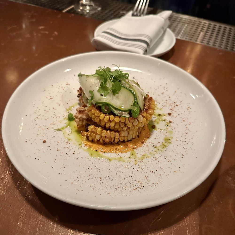 Boeufhaus - Corn riblets and shisito peppers on harissa aioli. - Brasseries Near Me - Chicago, Illinois Boeufhaus - Corn riblets and shisito peppers on harissa aioli. - Brasseries Near Me - Chicago, Illinois