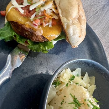 Fleur Cuisine - Vegan Southwest black bean sweet potato burger with garlic Parmesan mashed potatoes. - Caribbean Near Me - Rockport, Massachusetts Fleur Cuisine - Vegan Southwest black bean sweet potato burger with garlic Parmesan mashed potatoes. - Caribbean Near Me - Rockport, Massachusetts