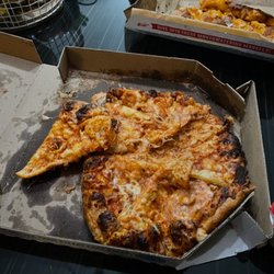 Domino's Pizza - This is what our pizza looked like when we opened the box!!!! We didn't touch this before taking the photo!!!