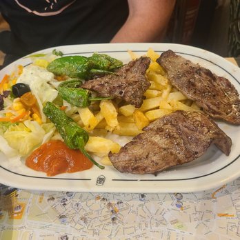La Tradicional - Imperial sirloin platter 14$ came with fries and salad and peppers. Yummy yummy beef was well done even though we order rare - Tapas Bars Near Me - Seville, SE