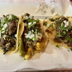 Taqueria Munoz - Cabeza tacos, one just how it comes, one with squash blossoms, and one with huitlacoche.