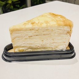 a slice of crepe cake on a plate a slice of crepe cake on a plate