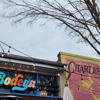 Bodega - a colorful sign on the side of a building - Sandwiches Near Me - Charleston, South Carolina