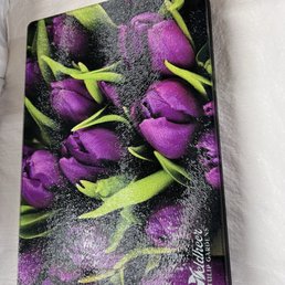 Cutting board with purple tulips. Cutting board with purple tulips.