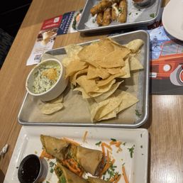 Appetizer, avocado rolls, spinach artichoke dip, cheese sticks.