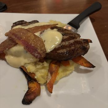 Eastside Grill - 12 oz steak with Gouda fondue and candied bacon - Steakhouses Near Me - Northampton, Massachusetts