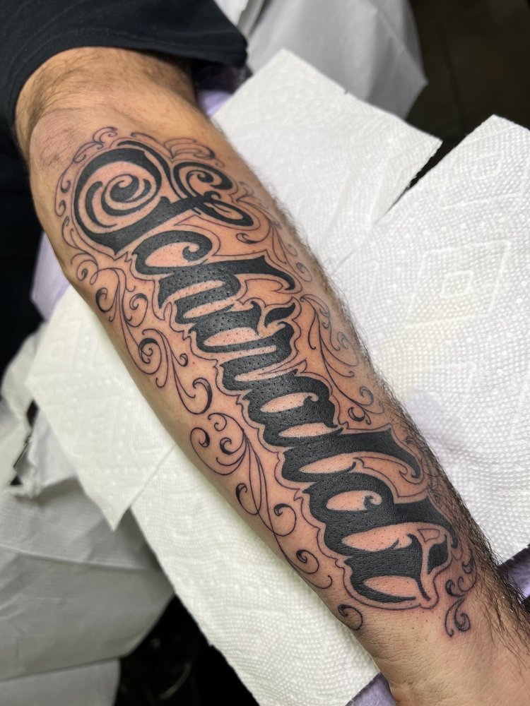 Vanguard Tattoo Logo