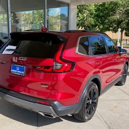 Exterior outside entrance of Livermore Honda - My new Honda CRV Touring, at the front of the beautiful showroom at Livermore Ford. - Livermore, California Exterior outside entrance of Livermore Honda - My new Honda CRV Touring, at the front of the beautiful showroom at Livermore Ford. - Livermore, California